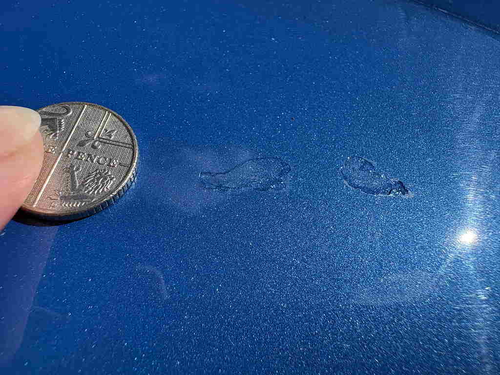 Stone chips on the bonnet, honest close-up